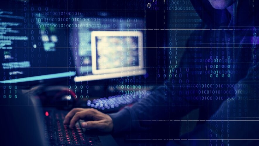 Hacker working using computer with codes