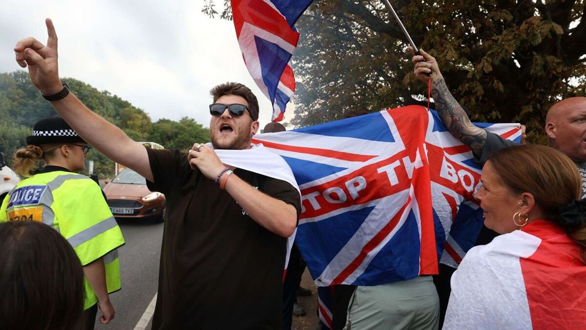 Mandatory Credit: Photo by Jacqueline Lawrie/LNP/Shutterstock (15447951s)Triumphant residents gather outside The Bell Hotel, Epping, Essex. Asylum seekers will be removed from the Bell Hotel in Epping, Essex, after Epping Forest district council was granted a temporary High Court injunction. .Bell Hotel Epping, Epping, Essex, UK - 19 Aug 2025/shutterstock_editorial_Bell_Hotel_Epping_Epping_Essex_15447951s//2508192030