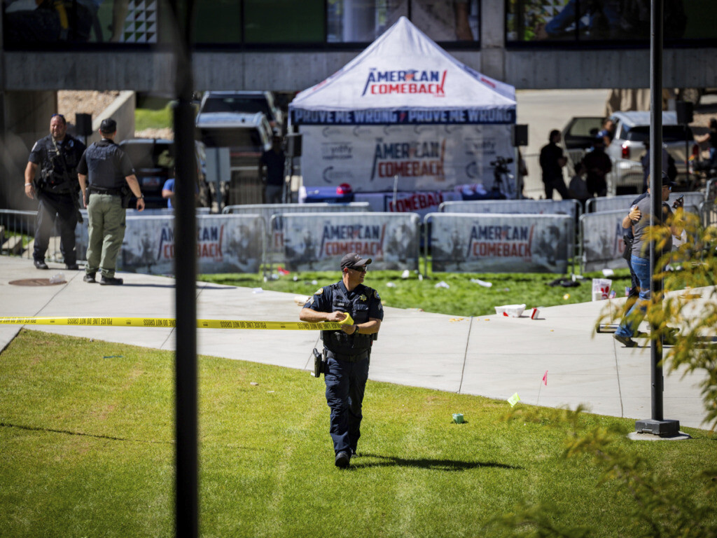 CORRECTS PHOTOGRAPHER LAST NAME FROM CROEWLEY TO CROWLEY - Law enforcement tapes off an area after Charlie Kirk, the CEO and co-founder of the conservative youth organization Turning Point USA, was shot at Utah Valley University, Wednesday, Sept. 10, 2025, in Orem, Utah. (Tess Crowley/The Deseret News via AP)
