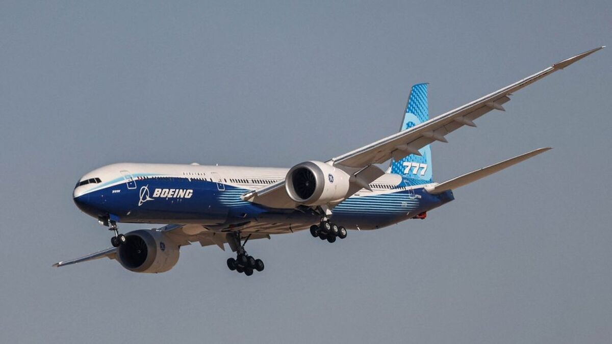 A Boeing 777X aircraft performs a demonstration flight at the 2021 Dubai Airshow in the Gulf emirate on November 14, 2021. (Photo by GIUSEPPE CACACE / AFP)