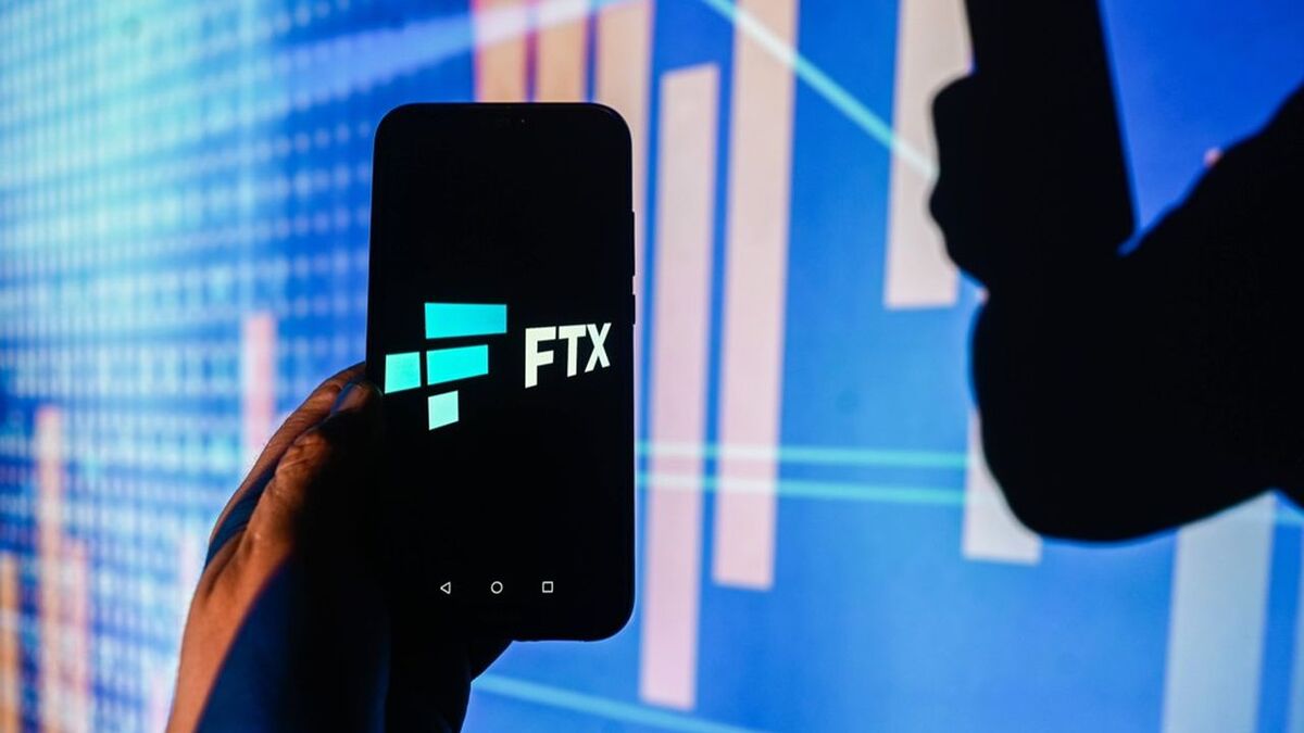In this photo illustration  a FTX logo is displayed on a smartphone with stock market percentages in the background. - Omar Marques / SOPA Images//SOPAIMAGES_omarques_14122023_phone_tech-15/Credit:SOPA Images/SIPA/2312151033