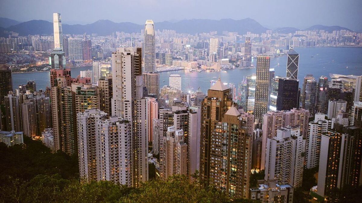Stunning cityscape view of Hong Kong skyline with skyscrapers and harbor at dusk. Hongkong, China (Photo by LB Studios / Connect Images via AFP)