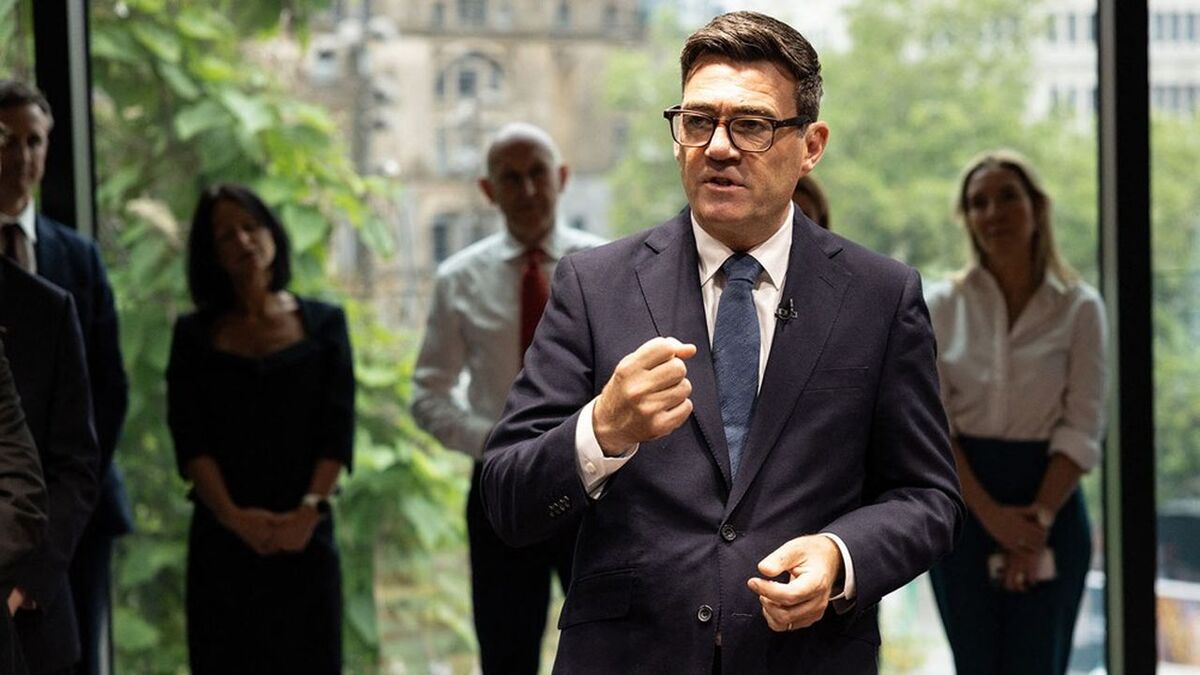 Britain's Prime Minister Andy Burnham speaks to staff members during a visit to officially open No10 North in Manchester, north-west England on July 24, 2026. British Prime Minister Andy Burnham was to open his newly created northern office on Friday, as he bids to launch his flagship move to reverse decades of centralising power over England in London. (Photo by James Speakman / POOL / AFP)