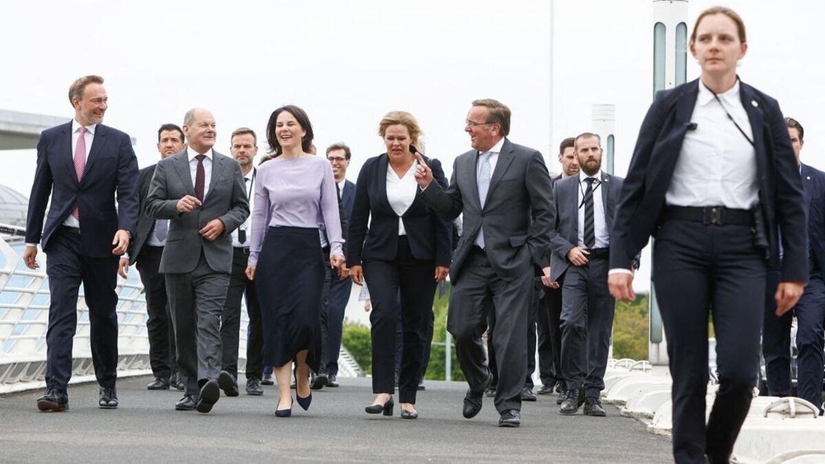 (L-R) German Finance Minister Christian Lindner, German Chancellor Olaf Scholz, German Foreign Minister Annalena Baerbock, German Interior Minister Nancy Faeser and German Defence Minister Boris Pistorius cross a footbridge as they walk to give a press conference on June 14, 2023 to present their national security strategy for the country. (Photo by MICHELE TANTUSSI / AFP)